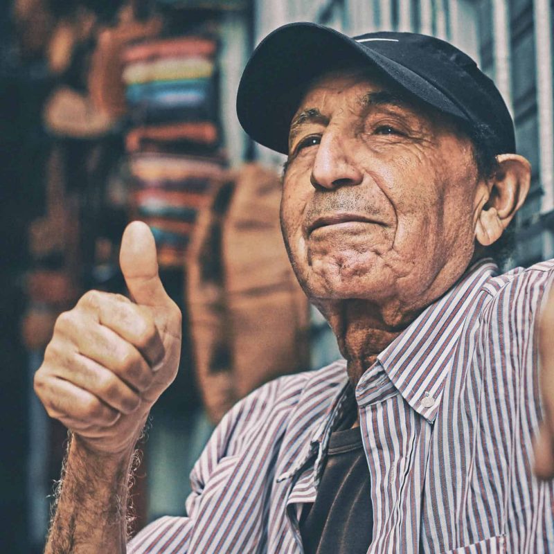 aziz-acharki-alANOC4E8iM-unsplash thumbs up elderly gentleman
