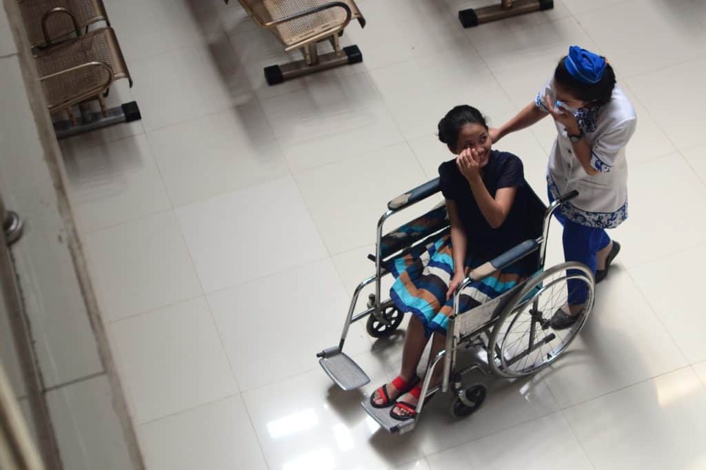 nurse and patient in a wheelchair