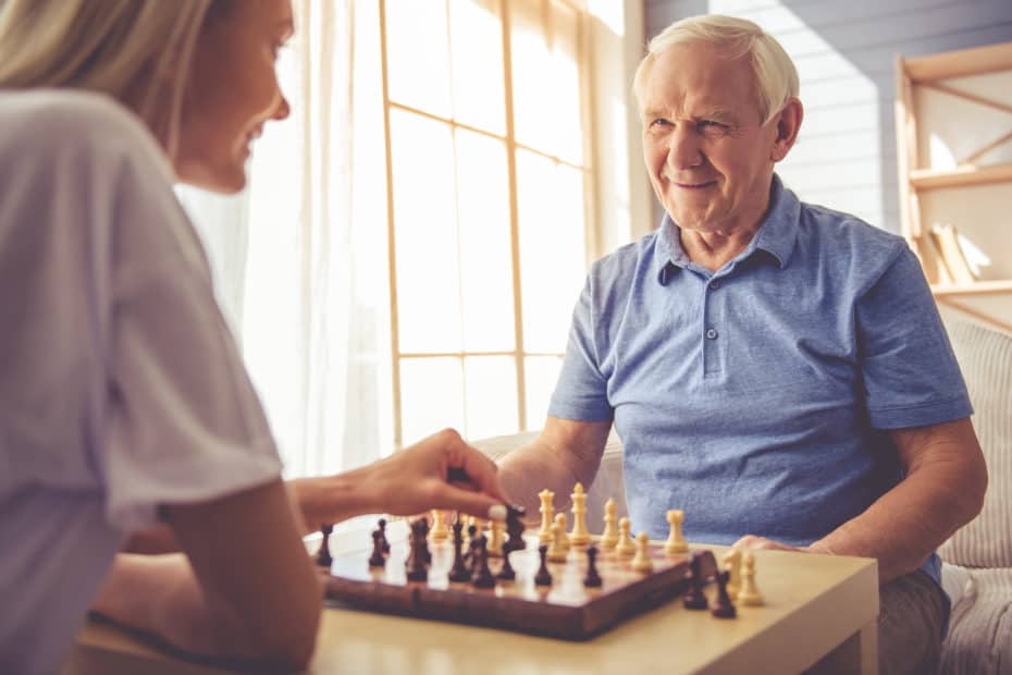 Older couple playing chess