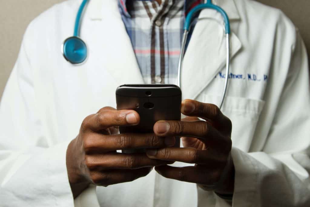 doctor hands on smart phone