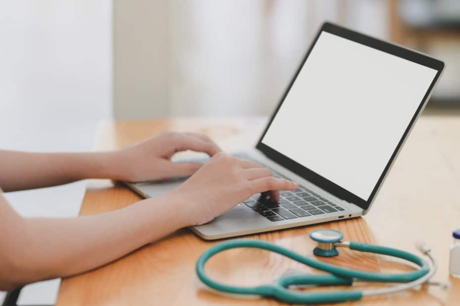 doctor using a laptop computer on a desk