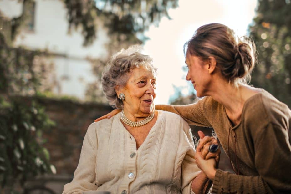 elderly woman being cared for