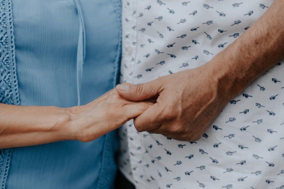 elderly holding hands