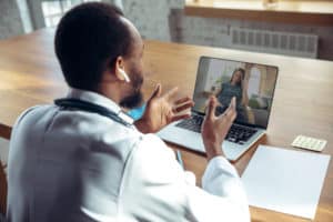health at home doctor speaking to patient via computer