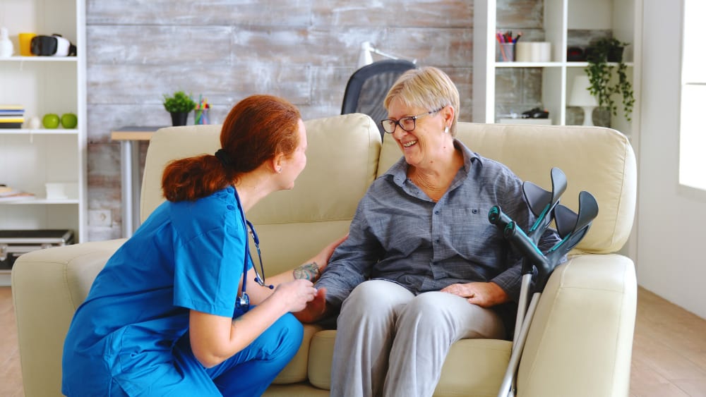 female-nurse-talking-with-old-woman-with-alzheimer-nursing-home